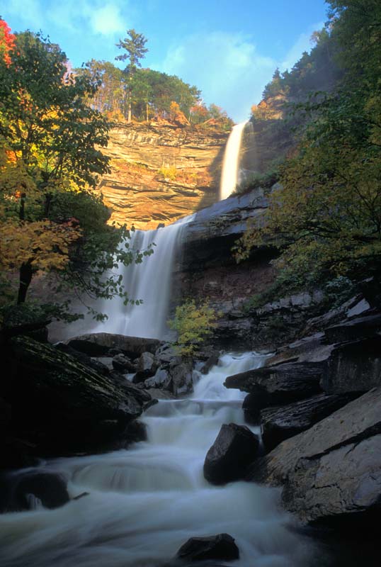 12-10.jpg - Kaaterskill Falls, Haines Falls, NY - the sun is setting and its last golden glow lights up the top of the falls while leaving the base in shade. In a few moments, the sun vanishes behind the Catskill Mountains and all is dark.